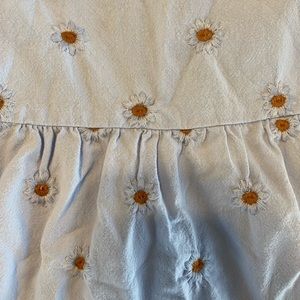 Girls dress with small daisy embroidery